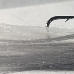 Fishing lure with hair coming out the end