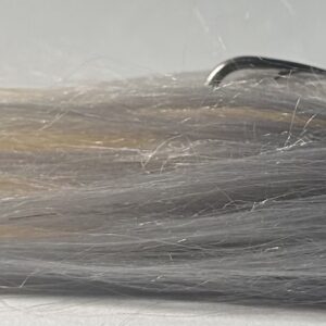 Fishing lure with hair coming out the end