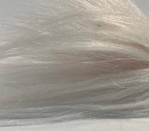 Fishing lure with hair out the end