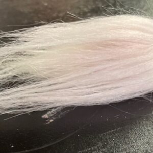 Fishing lure with hair coming out the end