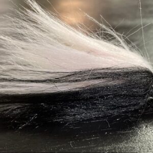 Fishing lure with hair coming out end